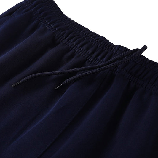 Conjunto de entrenamiento del Barcelona 25/26 (Chaqueta + Pantalón) Azul Marino y Naranja