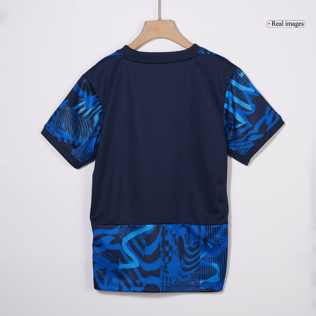 Kit de fútbol infantil de visitante del Atlético de Madrid (Kit y pantalón corto) 2024/25