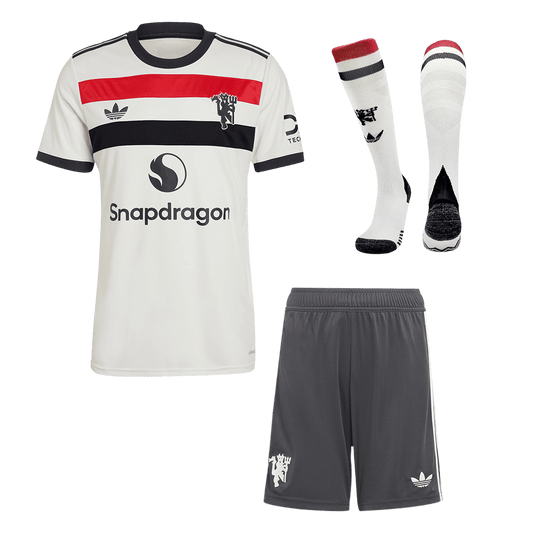 Kit de fútbol de visitante del Manchester United (camiseta, pantalón corto y calcetines)