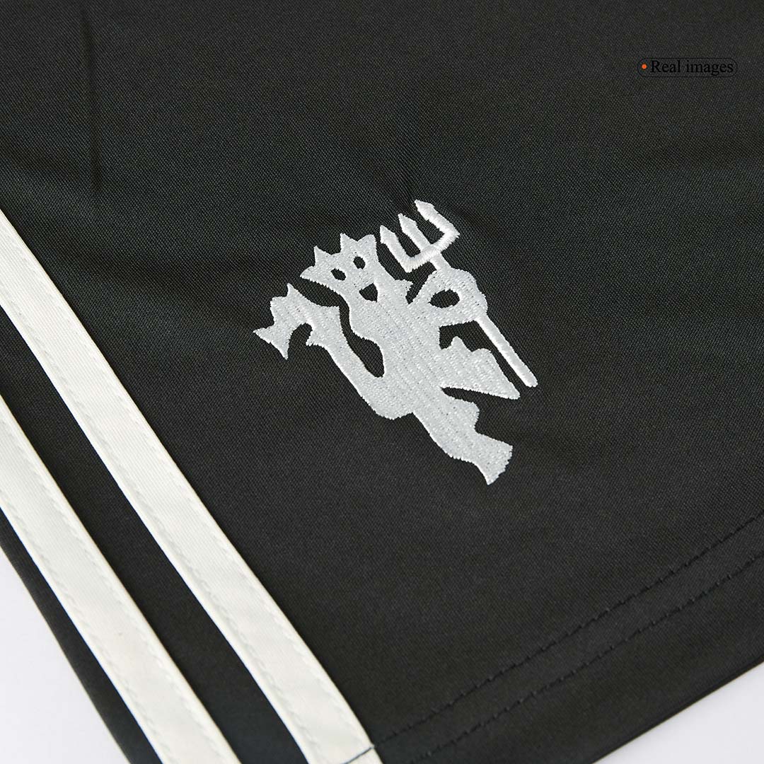 Kit de fútbol de visitante del Manchester United (camiseta, pantalón corto y calcetines)